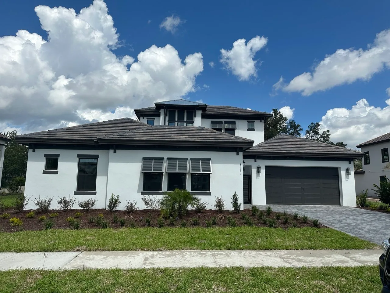 Single-storey home with tile roof under a Florida sky